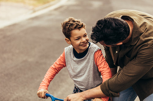 Kid learning to ride a bicycle
