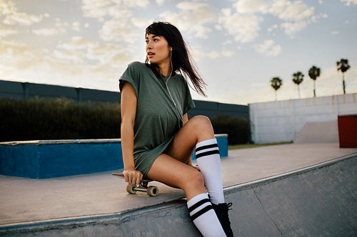 Female skateboarder at skate park