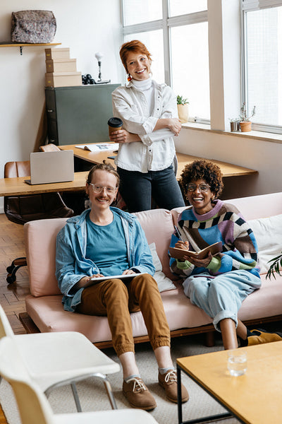 Creative team smiling in a bright co-working space