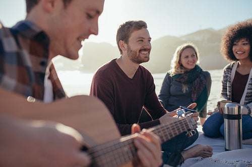 Young people having a party on beach