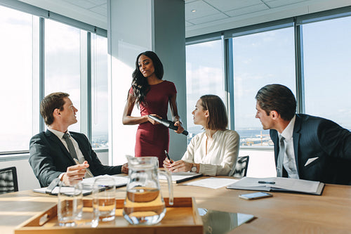 Group of business people having meeting in conference room