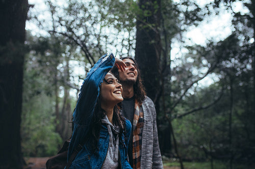 Couple walking through forest and enjoying the nature