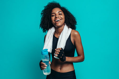Healthy woman taking a break after exercising
