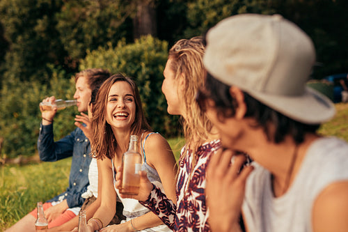 Group of friends hanging out at the lake