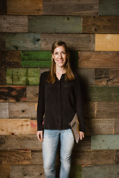 Portrait of young business woman looking happy