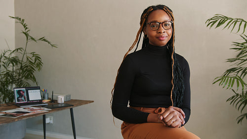 Cheerful graphic designer smiling at the camera