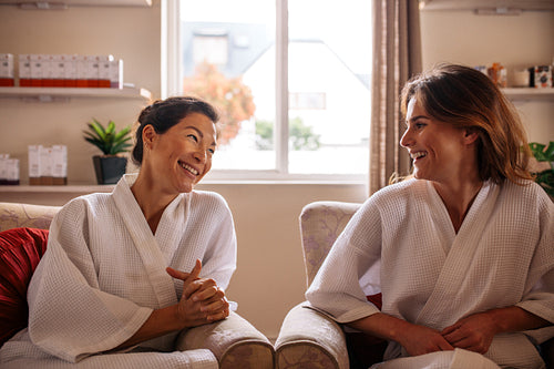 Women chatting in spa reception area