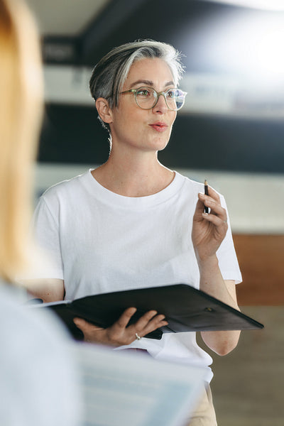 Female business manager having a meeting with her team