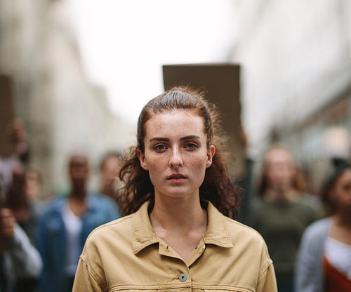 Woman activist protesting outdoors with group