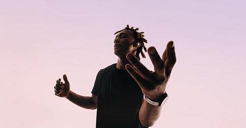 Energetic gen z dancer syncing with music on wireless smartwatch