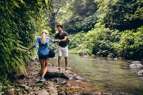 Couple in forest by the stream