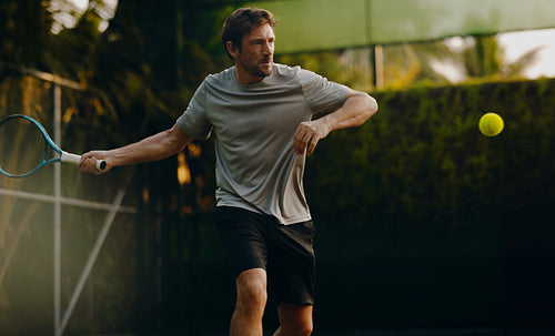 Tennis player enjoying a luxury vacation match