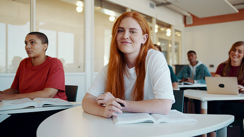 Smiling high school student in classroom