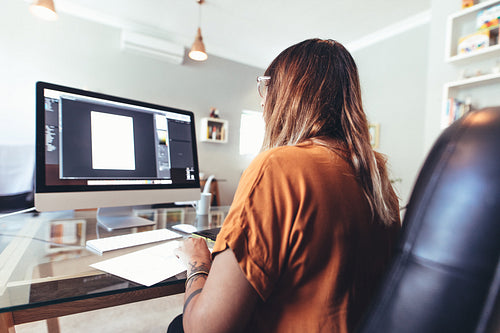 Illustrator at work in her office