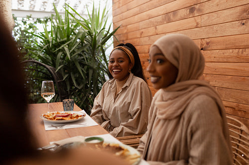 Female friends chatting over a meal