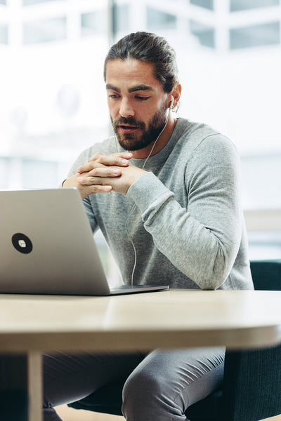 Modern businessman speaking during an online meeting