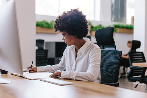 Female executive working at her office desk
