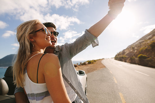 Couple capturing memories on their road trip