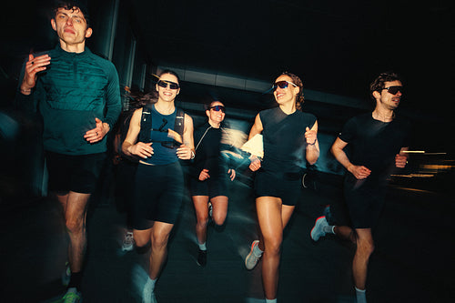 Night running session showcases a motivated group with strong fitness and energy