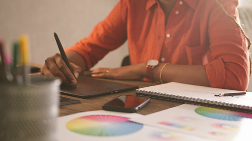 Graphic designer drawing on a graphics tablet