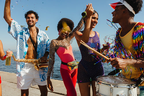 Carnival party by the water with friends