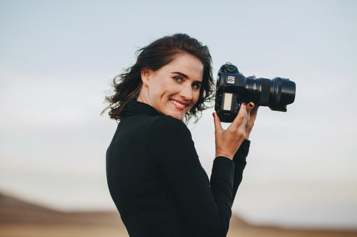 Woman photographing outdoors