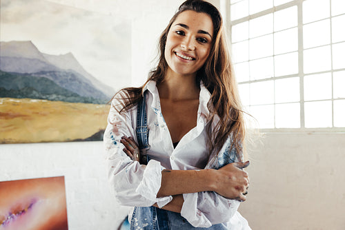 Cheerful artist smiling at the camera