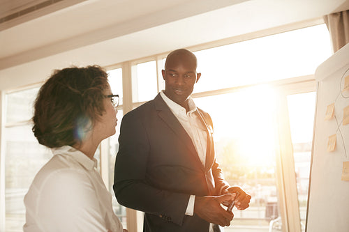 Business people discussing at meeting