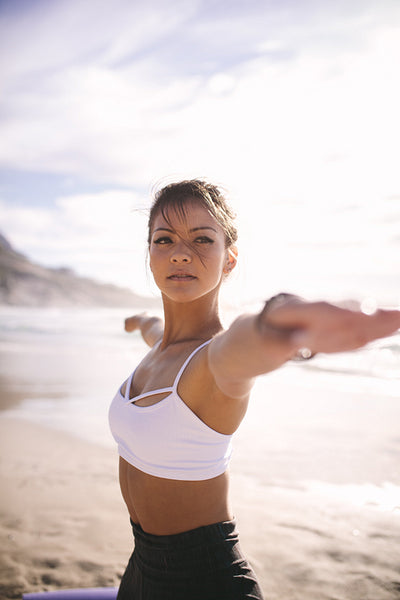 Woman performing yoga in warrior pose