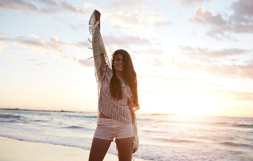 Beautiful female model having fun on the beach