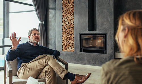 Psychotherapist counseling a woman with trouble