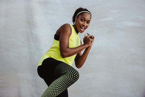 African fitness woman doing kick boxing workout