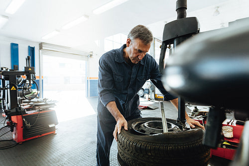 Man working in tire service workshop