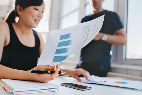 Woman doing financial analysis at office