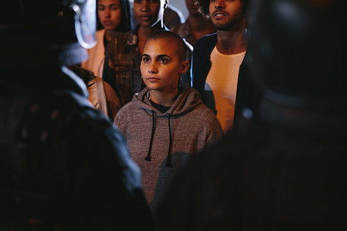 Woman activists staring at a policeman