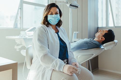 Female dentist with patient in a modern dental clinic