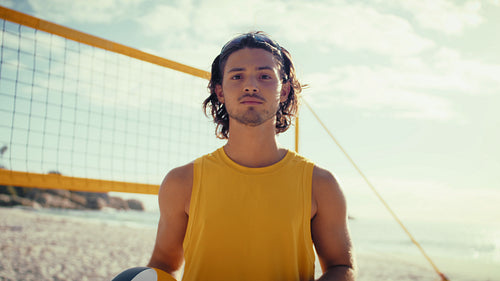 Portrait shot of male beach volleyball player looking at the camera