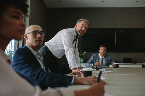 Business group having discussion at office meeting