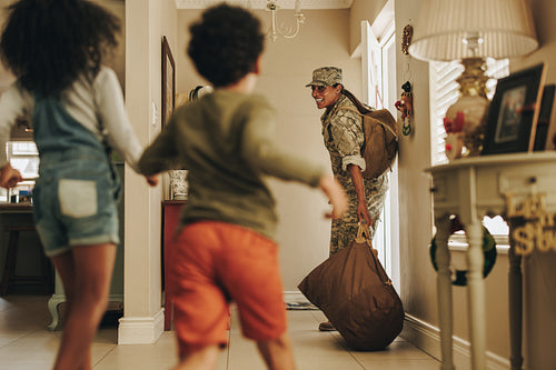 Happy military mom returning home to her children