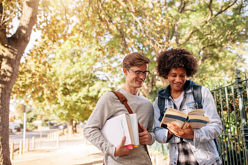 University students reading book in the college campus
