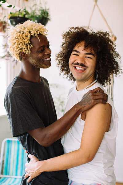 Carefree gay couple embracing each other