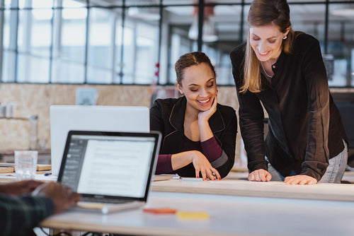 Two young woman working on a new creative design