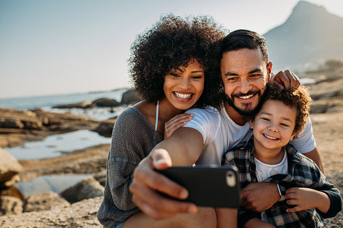 Family on a vacation posing for a selfie