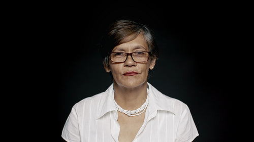 Happy senior woman in eyeglasses