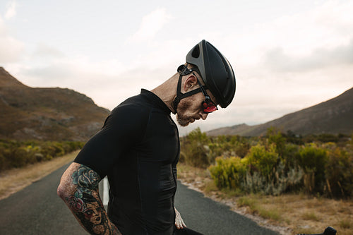 Professional cyclist taking a break