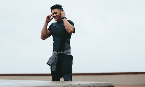 Smiling sportsman taking break from training
