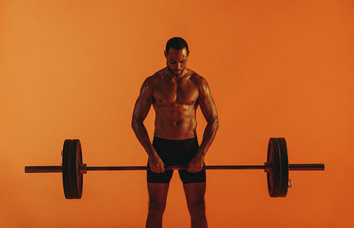 bodybuilder lifting barbell