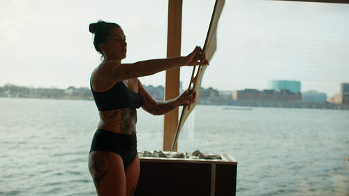 Sauna ritual with women relaxing during aufguss in a wooden spa interior
