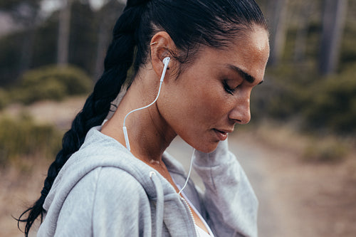 Runner listening music during outdoors workout