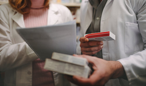 Chemist searching right medicine in pharmacy store